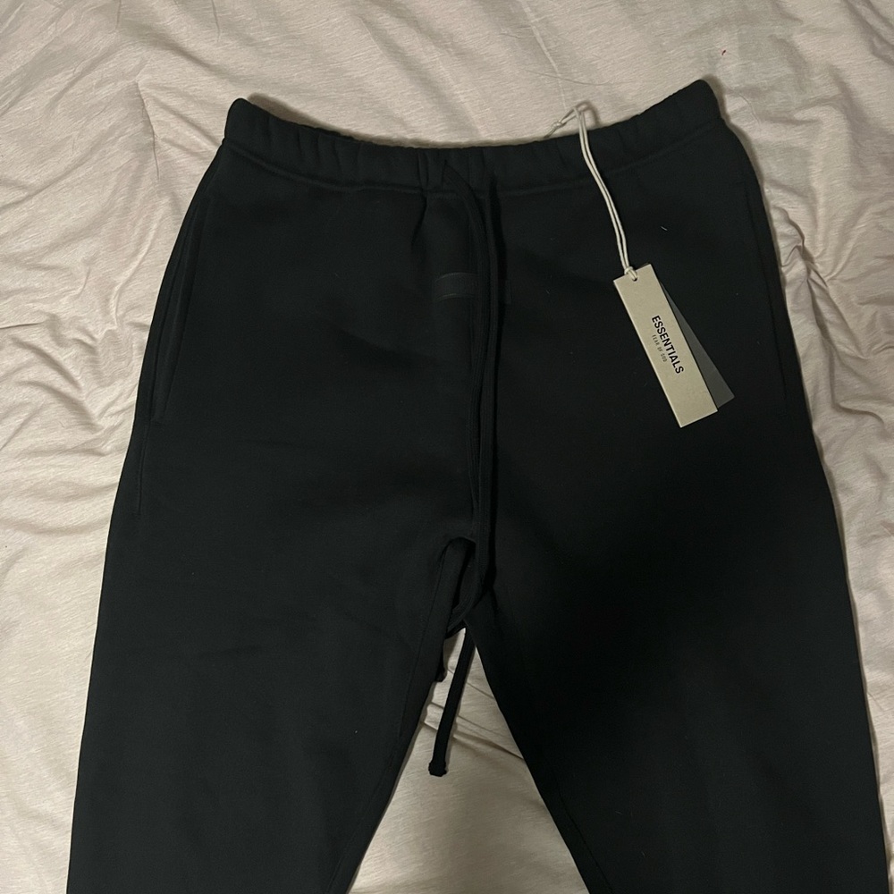 Men’s Essentials sweatpants, new with tags size medium, black.
